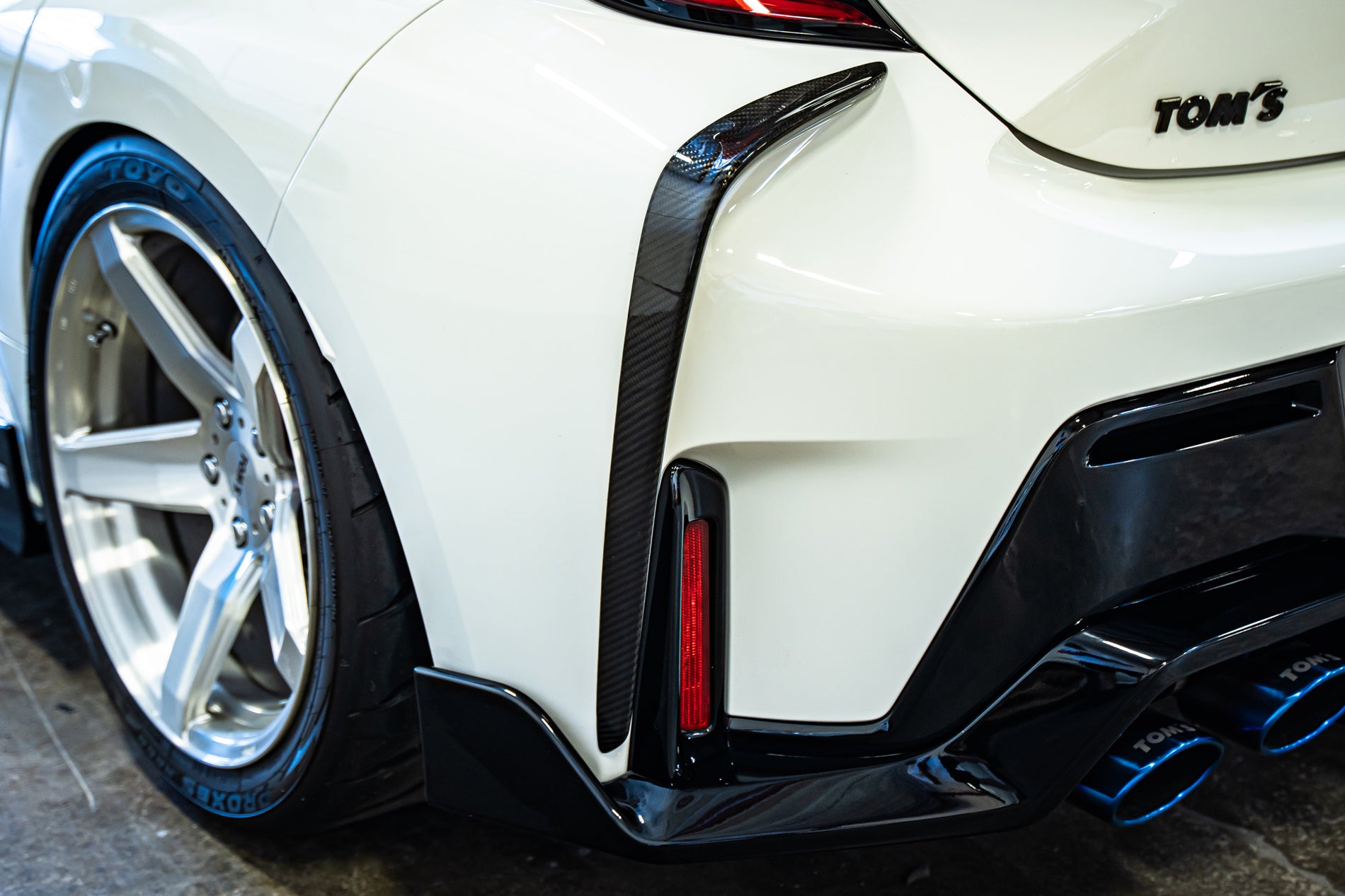 TOM'S Racing - Carbon Fiber Rear Bumper Garnish - Toyota GR Corolla [2023+]