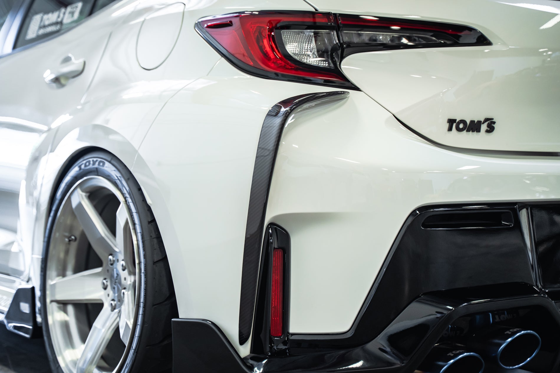 TOM'S Racing - Carbon Fiber Rear Bumper Garnish - Toyota GR Corolla [2023+]